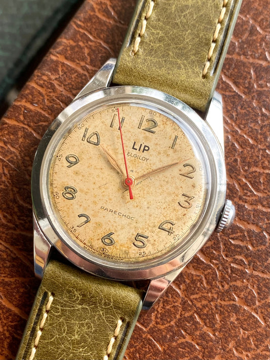 LIP Elgiloy R25 PareChoc Made In France Patinée - Montre Vintage Mécanique 1950